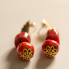 Pendientes Oceanía de coral rojo natural y acero dorado con baño de oro